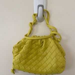 Yellow crossbody purse.